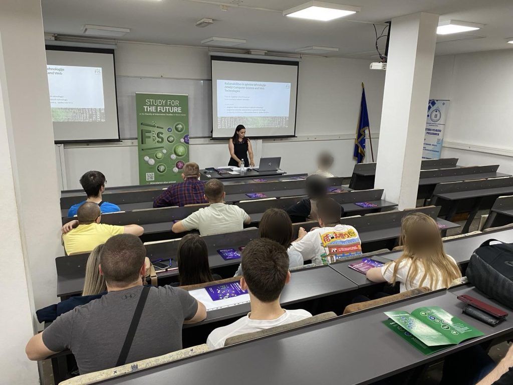 A talk in IPI Academy's lecture hall, students' faces blurred